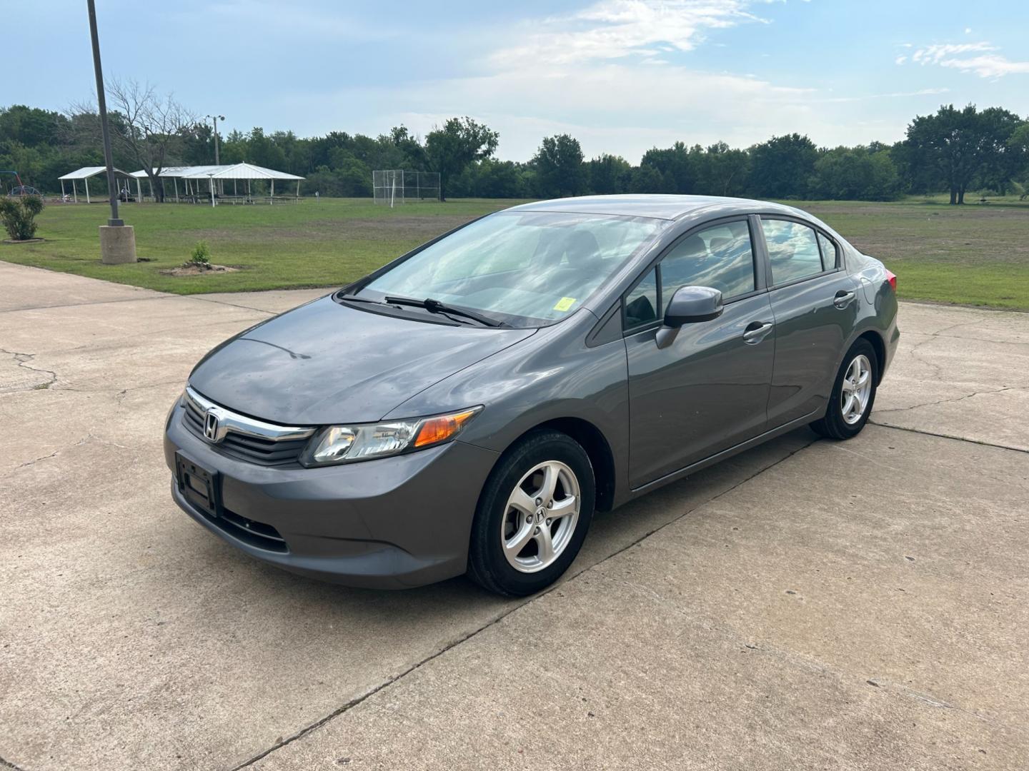 2012 GRAY /Gray Honda Civic CNG Sedan 5-Speed AT (19XFB5F56CE) with an 1.8L L4 SOHC 16V CNG engine, 5-Speed Automatic transmission, located at 17760 Hwy 62, Morris, OK, 74445, (918) 733-4887, 35.609104, -95.877060 - Photo#0